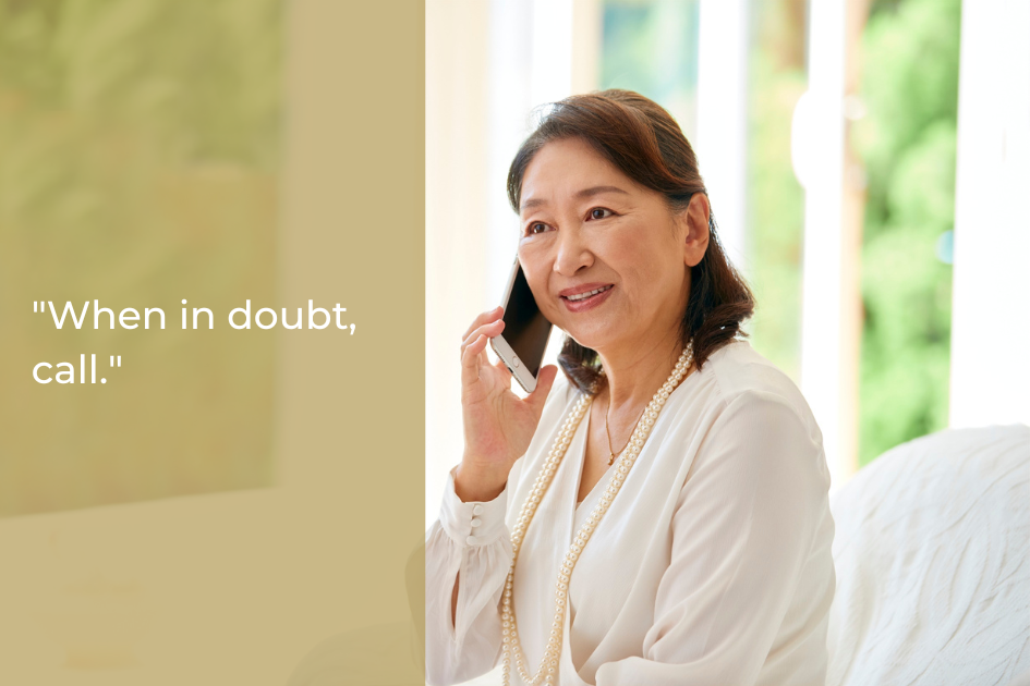 An older woman sits indoors, smiling and talking on a mobile phone. The text on the image reads, "When in doubt, call.